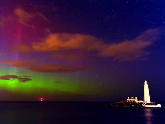 The Northern Lights over St Mary's Lighthouse near Whitley Bay. Pic: Owen Humphreys/PA Wire.