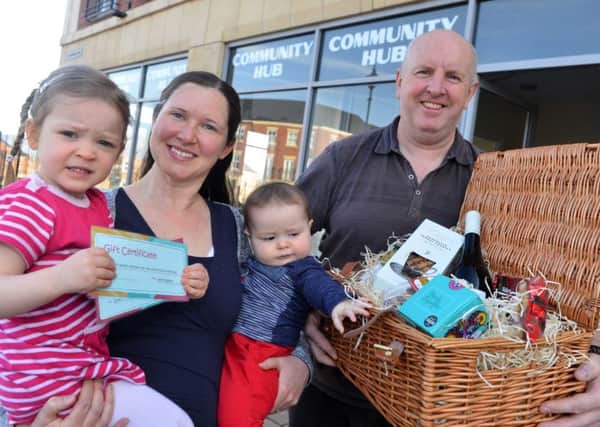 Westoe Crown Hub welecomes its 10,000 visitor Sarah Wiscombe with children James, 7  months and Libby, 3.
Centre manager Nick Roberts