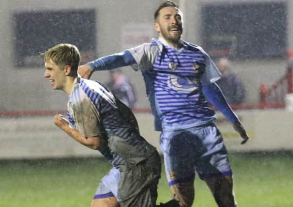 Jordan Blinco (left) races away to celebrate his double against Shildon. Picture by Peter Talbot