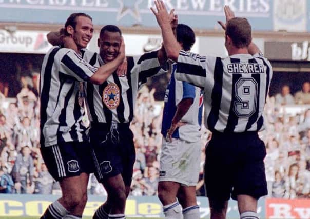 Darren Peacock and Alan Shearer celebrate a goal with Les Ferdinand.