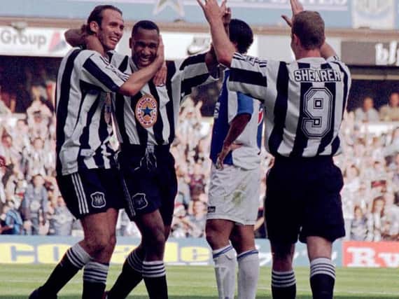 Les Ferdinand and Alan Shearer celebrate scoring against Blackburn Rovers.