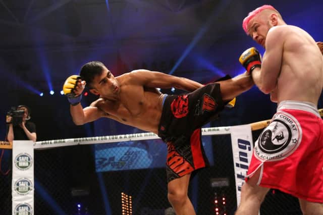 Shaj Haque goes on the attack against Martin McDonough. Picture by Dolly Clew, Cage Warriors.