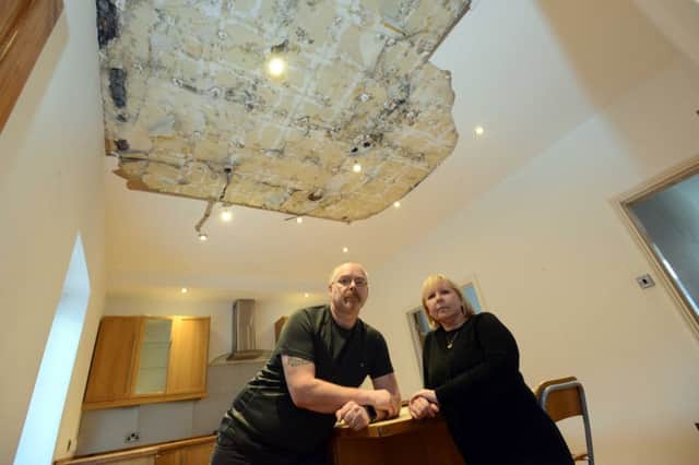 Landlords Sylvia and John Purcell with some of the damage in their house.