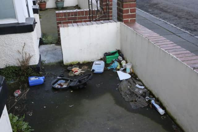 Rubbish left in the front yard of the property.