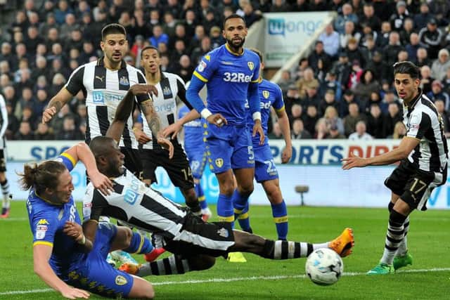 No penalty: Chancel Mbemba goes down in the Leeds box under challenge from Luke Ayling, but Newcastle's penalty appeals were waved away. Picture by Frank Reid