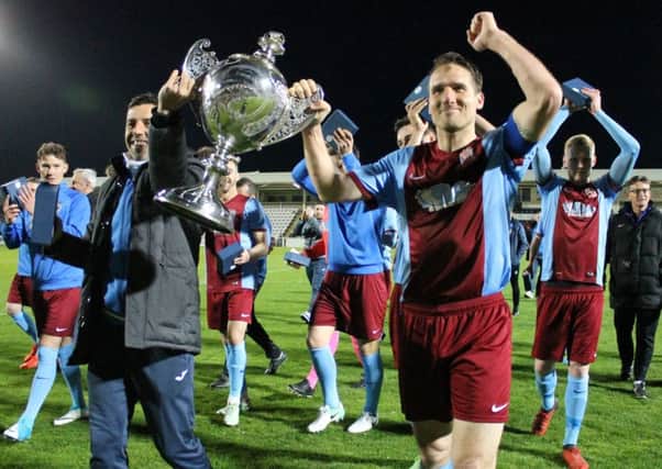 Delighted South Shields show off the Durham Challenge Cup to their happy fans at Hartlepool United last night. Picture by Peter Talbot