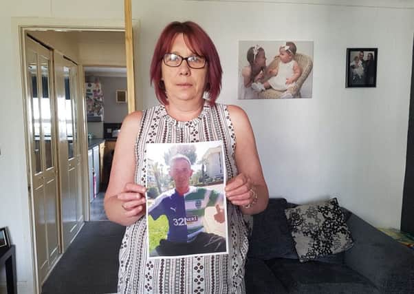Dorothy Glenn with a picture of her stepson, Gary Burns.