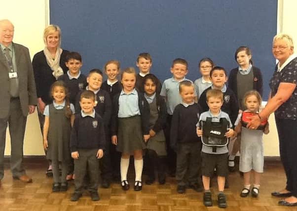 St Marys RC Primary School in Jarrow have been able to purchase a  defibrillator thanks to a donation Hebburn Iona Fireside Session.