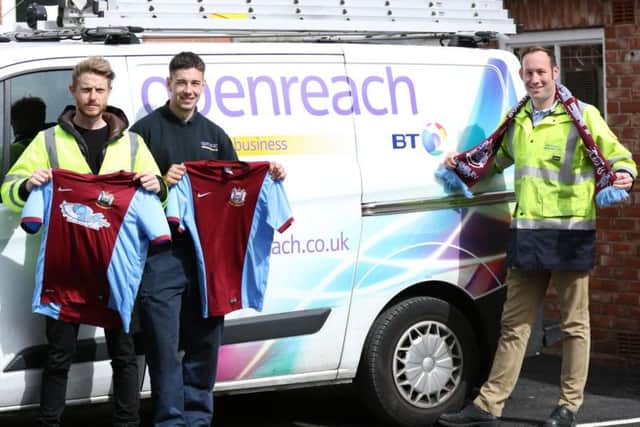 Robert, centre, with Openreach colleagues Ross Walton, senior operations manager, left, and Michael Sowiak, operations manager. Image by Peter Talbot.