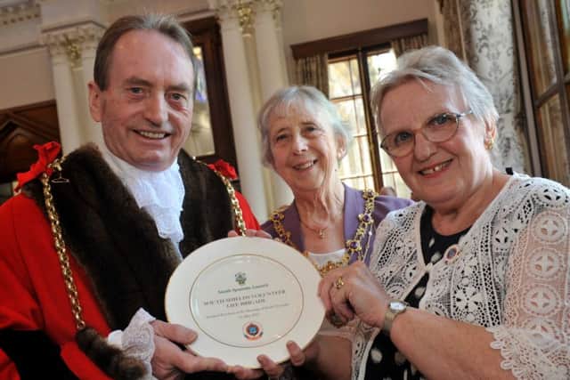 The Mayor and Mayoress, Couns Alan Smith and Moira Smith, present SSVLB president Janis Blower with the first commemorative plate.