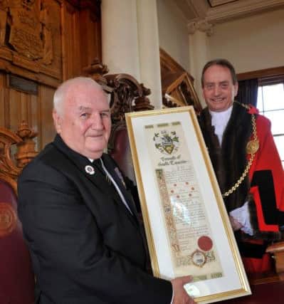 Tom Fennelly receives the prestigious Freedom Scroll from the Mayor.