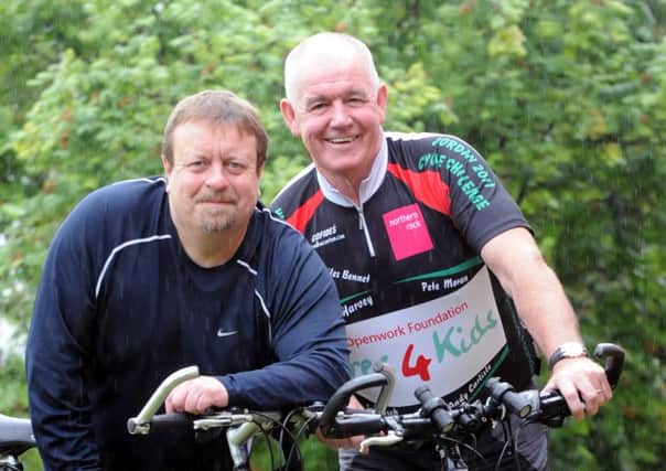 David Sinclair and David Ridley, left, prepare for their bike ride across India