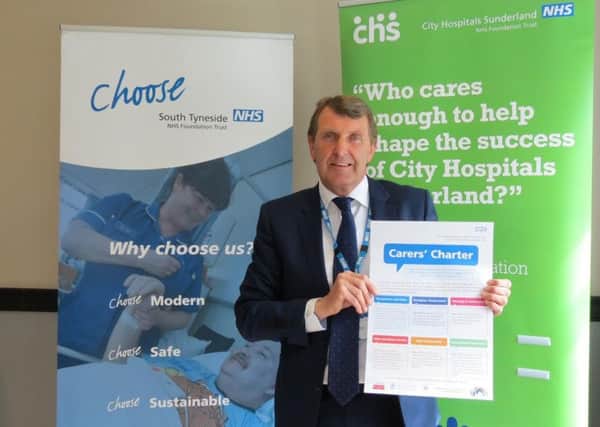 Ken Bremner, chief executive of City Hospitals Sunderland and South Tyneside NHS Foundation Trust with the Carers Charter.