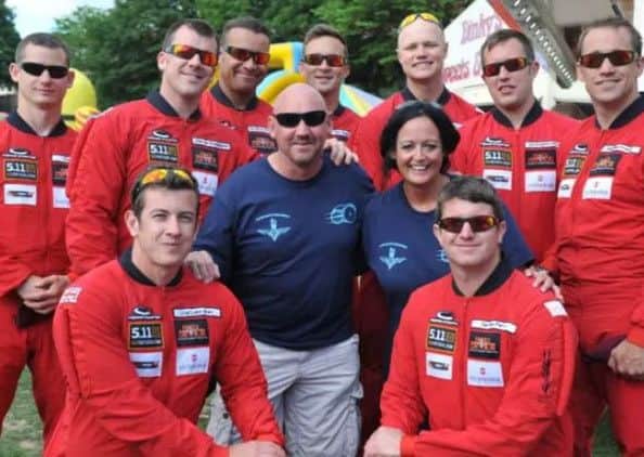 Red Devils Parachute Display Team members with Tom and Carla Cuthbertson at the end of Cuthy's Big Bike Ride.
