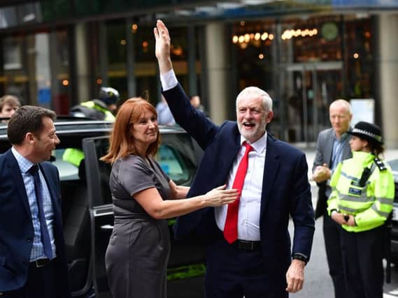 Labour leader Jeremy Corbyn is greeted by hiis Office Director Karie Murphy as he arrives at Labour Party HQ in Westminster. Picture: PA.