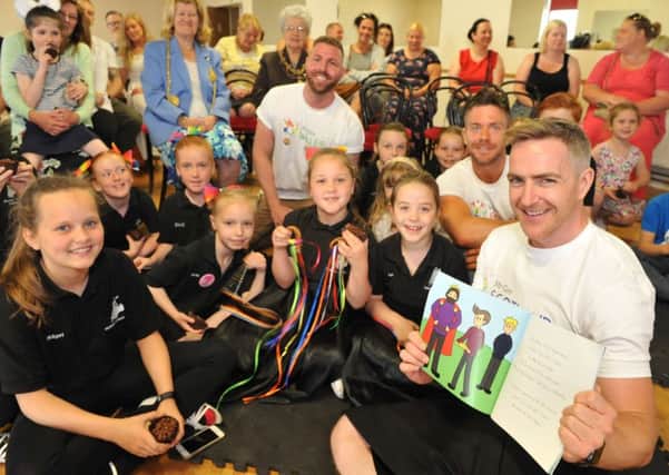 Mr Gay Scotland, England and Wales read a story to youngsters at Hatton Dance Academy.
