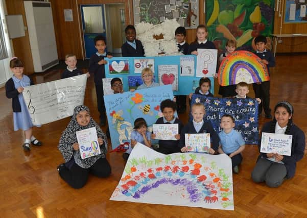 Pupils from Laygate Community School with a selection of their art work.