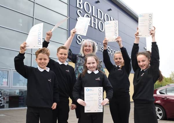 The Customs House learning officer Elizabeth Kane with Boldon School pupils (from left) Jonny Holman, Lucy Hughes and Caitlyn Amess.