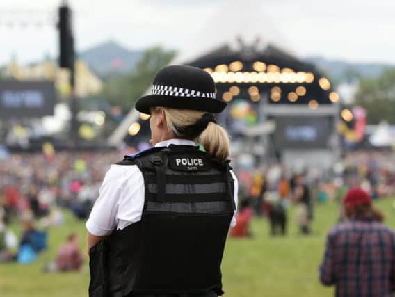 A police officer at a prevous Glastonbury Festival Co-organiser Emily Eavis has said staff are working closely with police to make sure the festival is 'the most safe place that it can possibly be' in the wake of the terror attacks in London and Manchester. Picture by Yui Mok/PA Wire