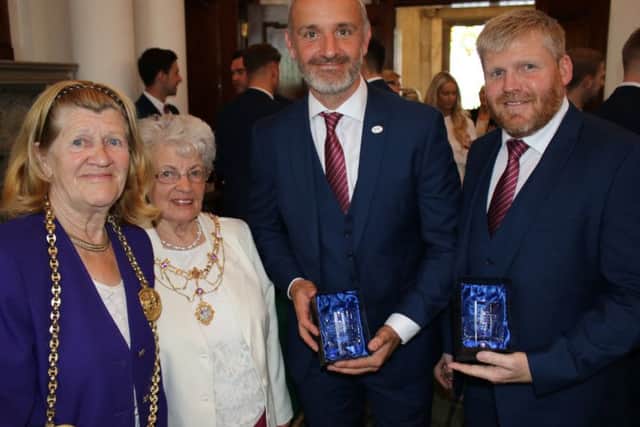 From left, the Mayor of South Tyneside, Coun Olive Punchion, and Mayoress Mary French, present South Shields FC joint managers Lee Picton and Graham Fenton with mementos to mark the club's incredible season. Image by Peter Talbot.