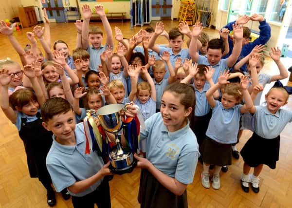 The Liam Curry Memorial Cup winners at SS Peter and Paul RC Primary School. House captain Darci Shaw, 10 and vice captain Michael Hassan, 11