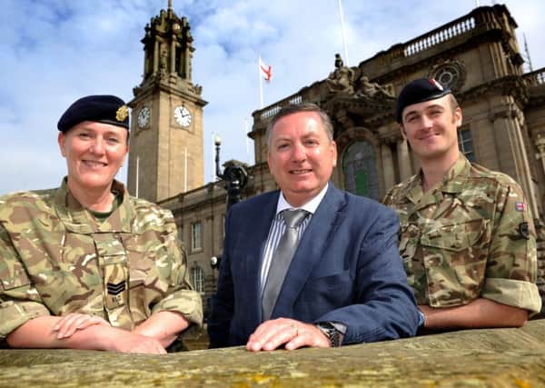 Cllr Ed Malcolm joins reservists Kay Gilchrist-Ward and Kyle Magge outside South Shields Town Hall.