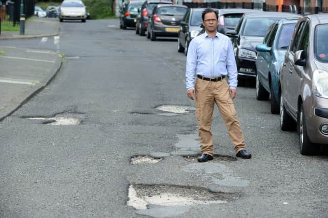 Ali Hayder compaints over pot holes at Bedford Avenue Laygate