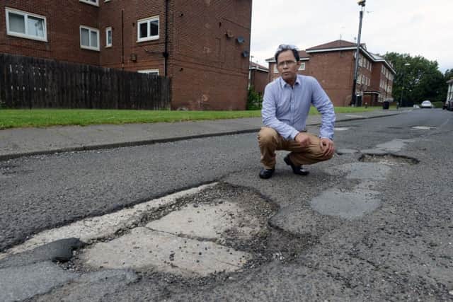 Ali Hayder compaints over pot holes at Bedford Avenue Laygate