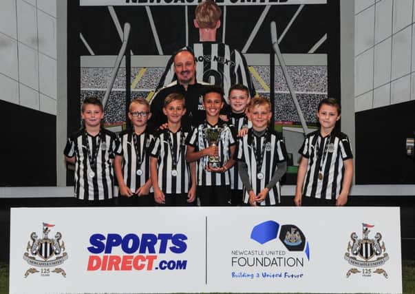 Newcastle manager Rafael Benitez poses with the winning boys team at the Foundation 1892 Cup at the Newcastle United Academy yesterday. Picture by Serena Taylor/NUFC