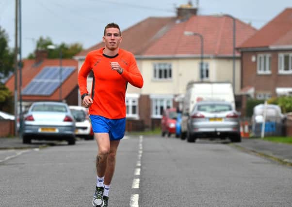 Callum Larson is to run a half marathon every week in memory of his father  Gavin Larson