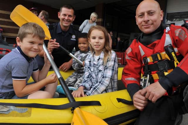 Youngsters Jay Harbertson, Archie Apomah and Macey Hailstone with fire crew Peter Hamil and Angelo Quintano at South Shields Community Fire Station open day.