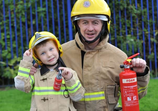 Cameron Spoors with fireman Brian Lazzari at South Shields Community Fire Station open day.