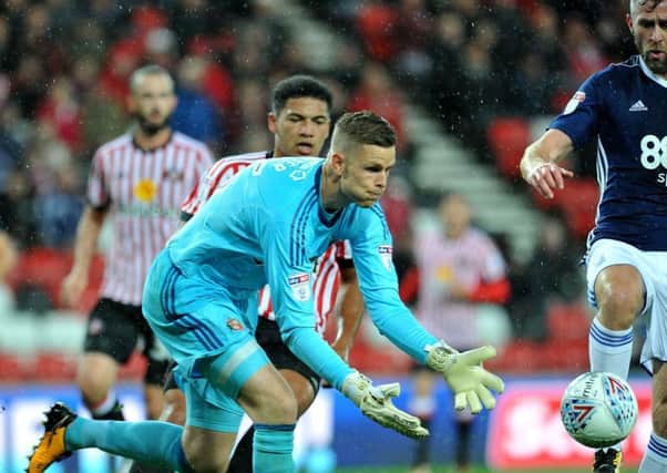 Sunderland keeper Robbin Ruiter gathers the ball under pressure from Forest's Daryl Murphy. Picture by Frank Reid
