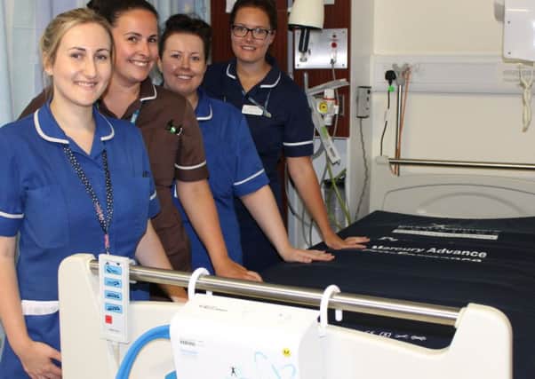 From left, staff nurse Karen Temple; auxillary nurse Victoria Elliot; staff nurse Amy Halliday and deputy ward manager Michelle Carhart with one of the new mattresses and special pumps.