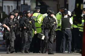 Armed officers outside Parsons Green tube station.