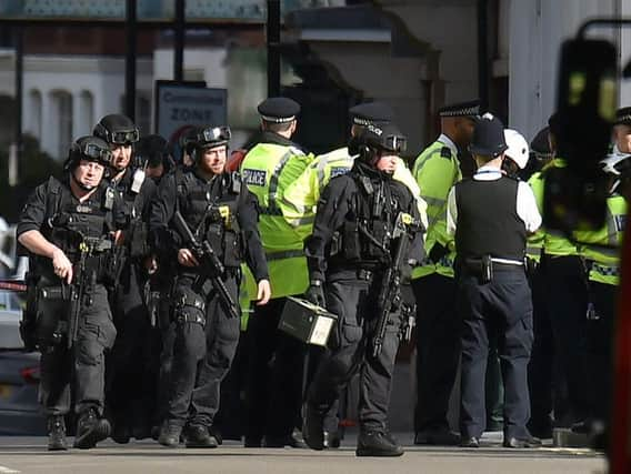 Armed officers outside Parsons Green tube station.