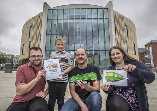Eight-year-old Samuel Kinsey with his dad Alan, Steve Mayes - aka BrickThis - and mum Michelle outside of The Word, National Centre for the Written Word, in South Shields.