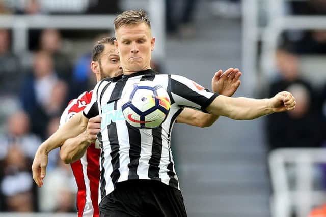 Matt Ritchie (front) in action against Stoke