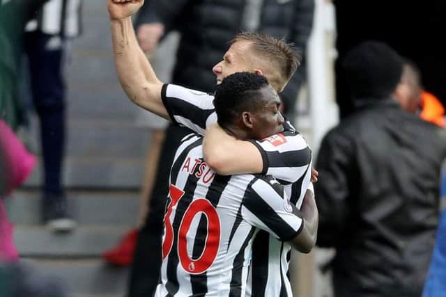 Christian Atsu and Matt Ritchie celebrate after the latter set up the former against Stoke