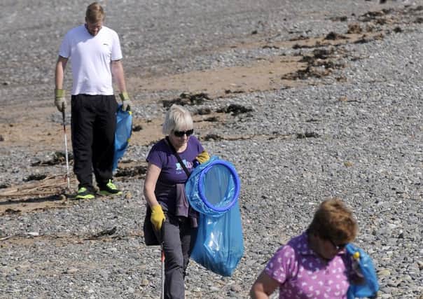 Volunteers and members of the Rossall Beach Residents and Community Group take part in a beach clean