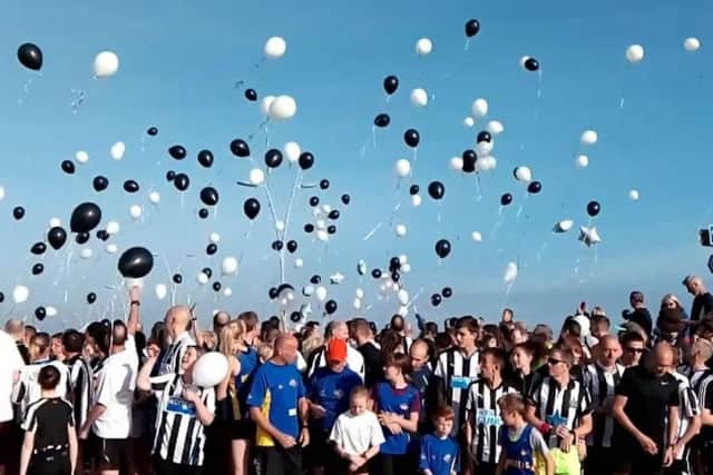 Balloons were released following on from a round of applause.