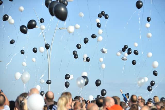 South Shields Park Run competitors pay tribute to fellow runner Mark Wood, by sporting Newcastle United football shirts, and releasing black and white balloons.