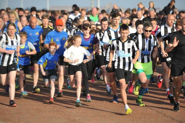 South Shields Park Run competitors pay tribute to fellow runner Mark Wood, by sporting Newcastle United football shirts, and releasing black and white balloons.