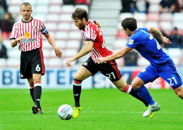 Adam Matthews and Lee Cattermole in action against Cardiff.
