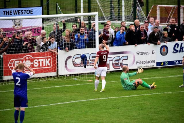 Carl Finnigan celebrates his goal against Clitheroe last Saturday. Image by Peter Talbot.