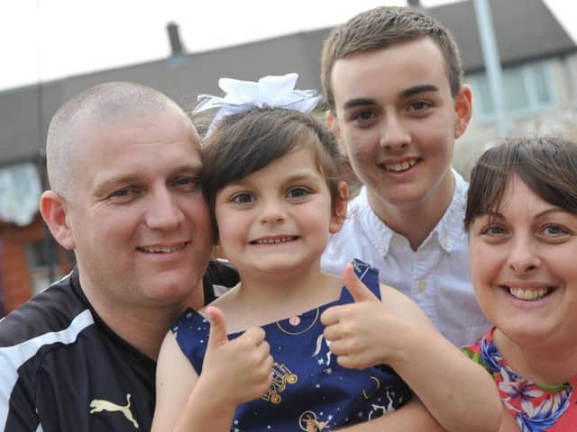 Kayleigh Brennan is now in remission, with parents Rob and Lindsay, brother Daniel.