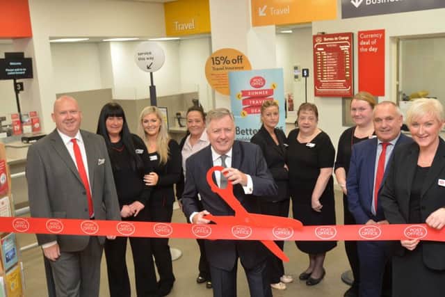 South Tyneside Council leader Coun Iain Malcolm with staff at the official opening of the new South Shields Post Office.