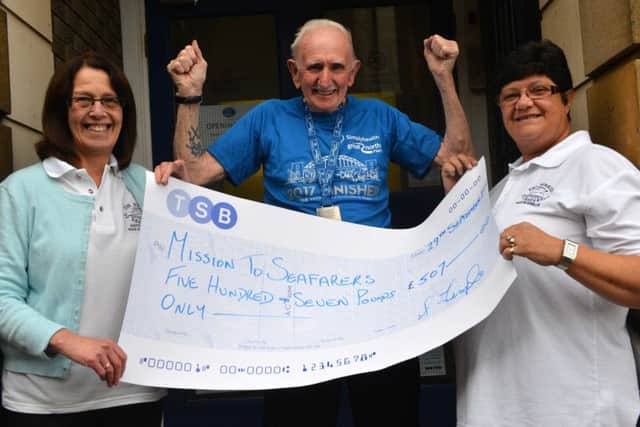 Stewart Temple hands over funds raised from the Great North Run to Missions To Seafarers Gill Moyse (L) and Diane Erskine (R)