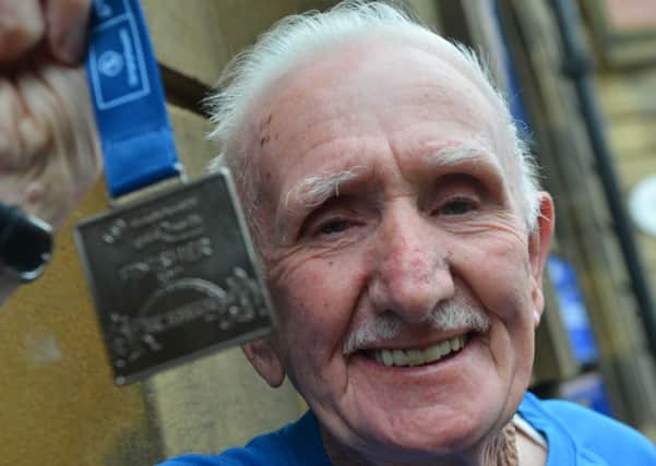 Stewart Temple with his  Great North Run medal.