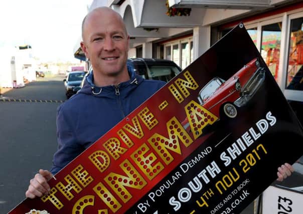 Philip Shearing with the advertising board for the up and coming Drive In Movies. Picture by FRANK REID
